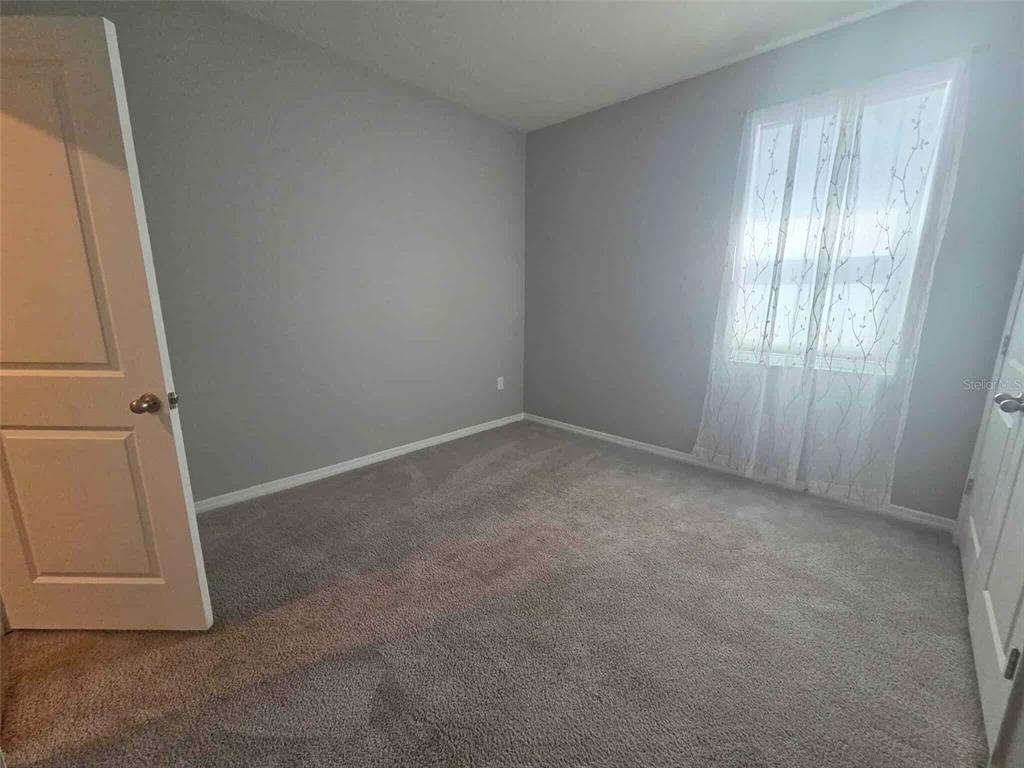 3927 Lively Coral Place Bradenton, FL 34208 - Photo 28 of 44 an empty room with windows