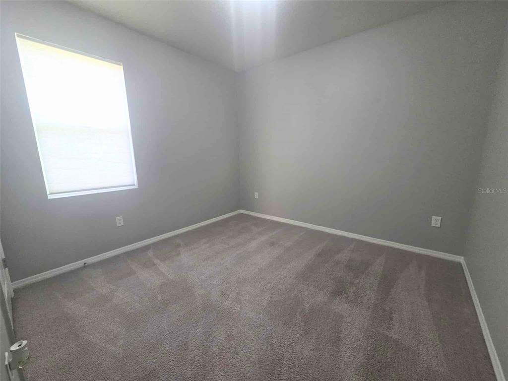 3927 Lively Coral Place Bradenton, FL 34208 - Photo 29 of 44 an empty room with a window