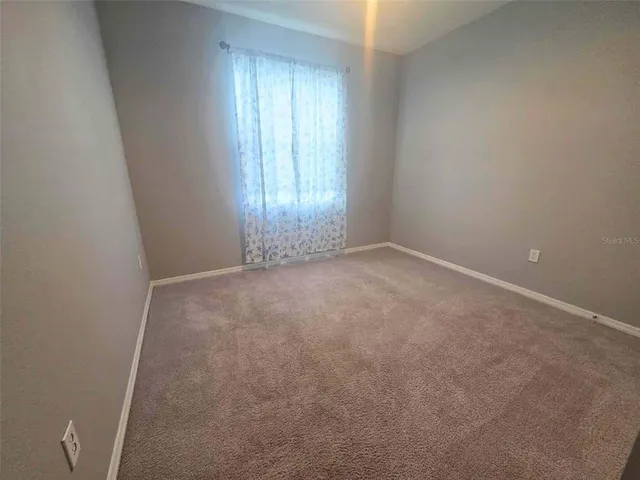 an empty room with an entryway