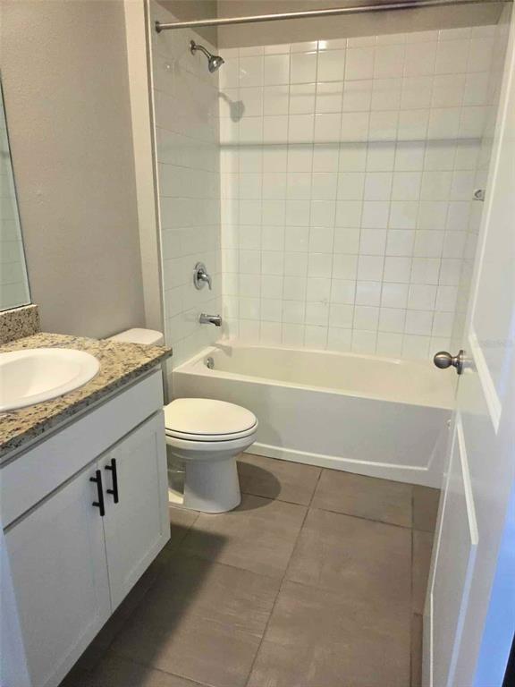 3927 Lively Coral Place Bradenton, FL 34208 - Photo 32 of 44 a bathroom with a granite countertop sink a toilet and shower