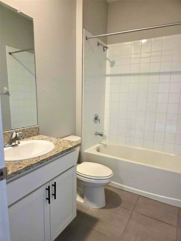 3927 Lively Coral Place Bradenton, FL 34208 - Photo 34 of 44 a bathroom with a granite countertop sink mirror toilet and bathtub