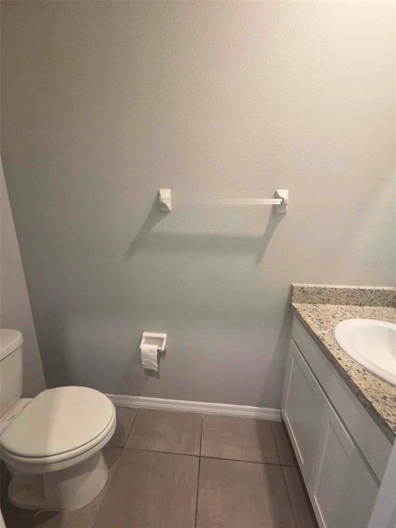 3927 Lively Coral Place Bradenton, FL 34208 - Photo 35 of 44 a bathroom with a granite countertop toilet and a sink