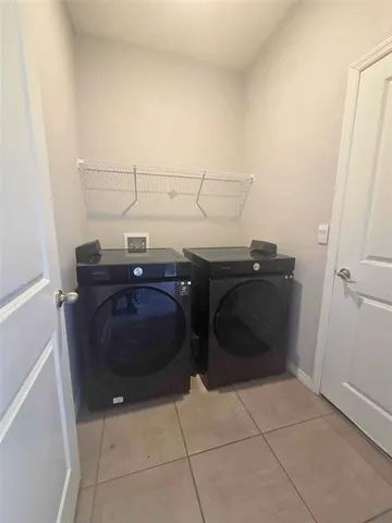 a utility room with dryer and washer
