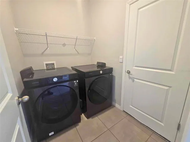 a view of an empty room with glass door