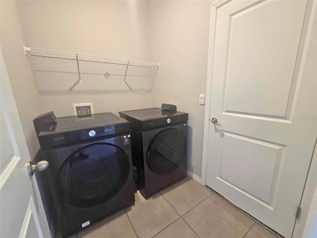 3927 Lively Coral Place Bradenton, FL 34208 - Photo 37 of 44 a utility room with dryer and washer
