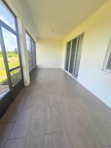 a view of a hallway with windows