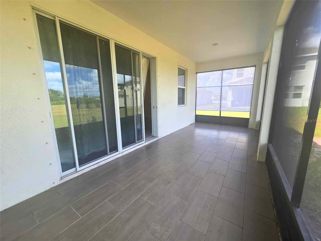 3927 Lively Coral Place Bradenton, FL 34208 - Photo 39 of 44 a view of a hallway with windows