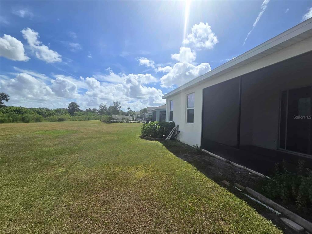3927 Lively Coral Place Bradenton, FL 34208 - Photo 40 of 44 a view of a house with a yard