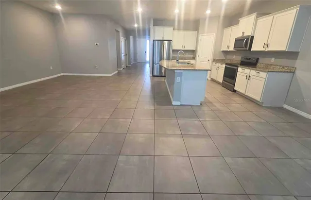 a large kitchen with cabinets in it