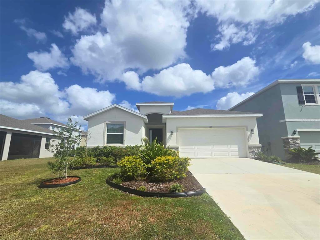3927 Lively Coral Place Bradenton, FL 34208 - Photo 44 of 44 a front view of house with yard and green space