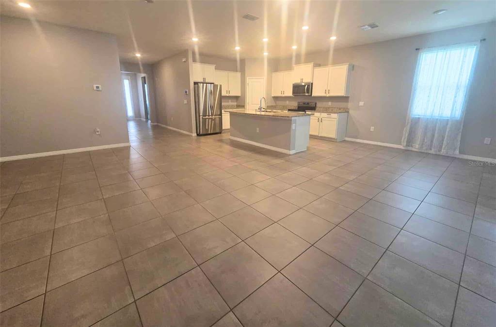 3927 Lively Coral Place Bradenton, FL 34208 - Photo 9 of 44 a large kitchen with cabinets