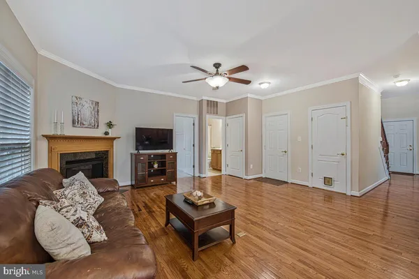 a living room with furniture fireplace and flat screen tv
