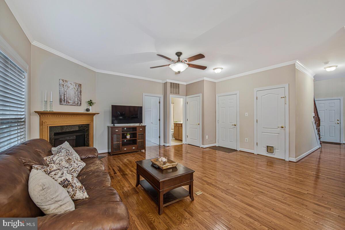 620 Crawfords Ridge Road Odenton, MD 21113 - Photo 13 of 43 a living room with furniture fireplace and flat screen tv