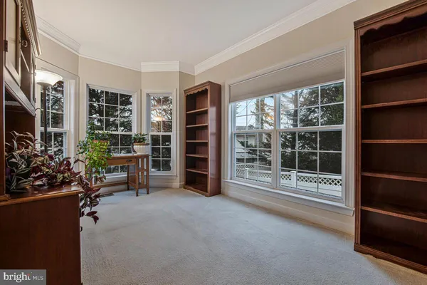 a view of a livingroom with furniture and staircase