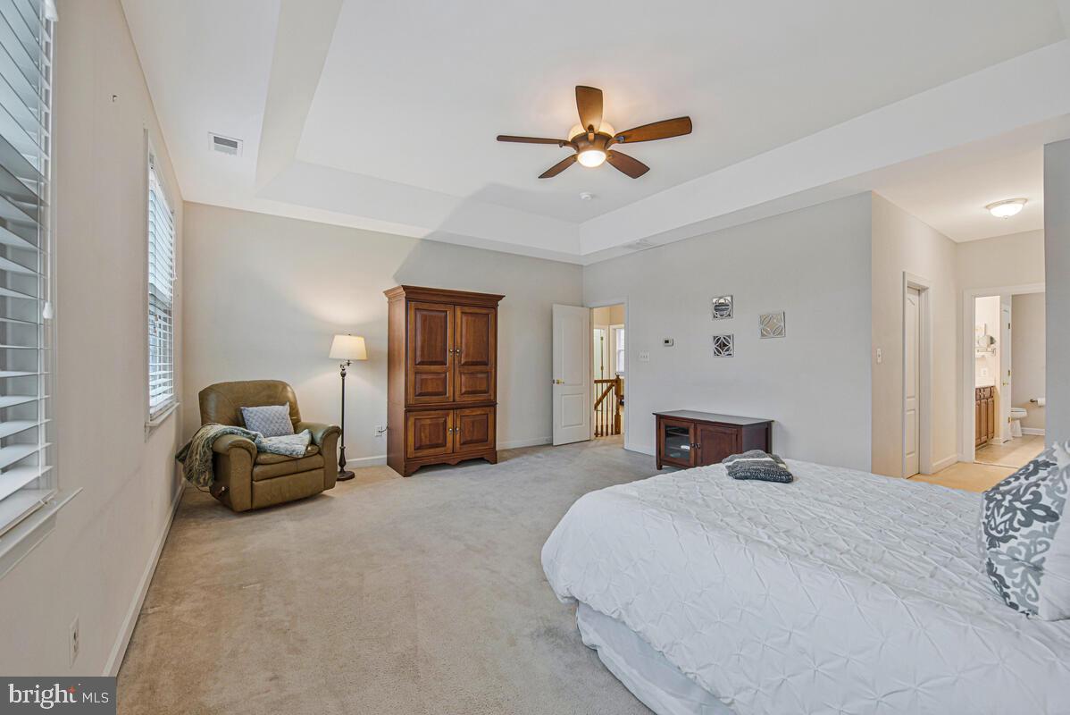 620 Crawfords Ridge Road Odenton, MD 21113 - Photo 22 of 43 a bedroom with a balcony and ceiling fan