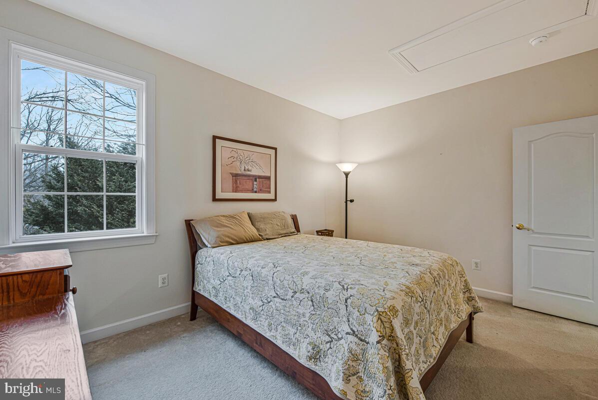 620 Crawfords Ridge Road Odenton, MD 21113 - Photo 26 of 43 a bedroom with a bed and a window