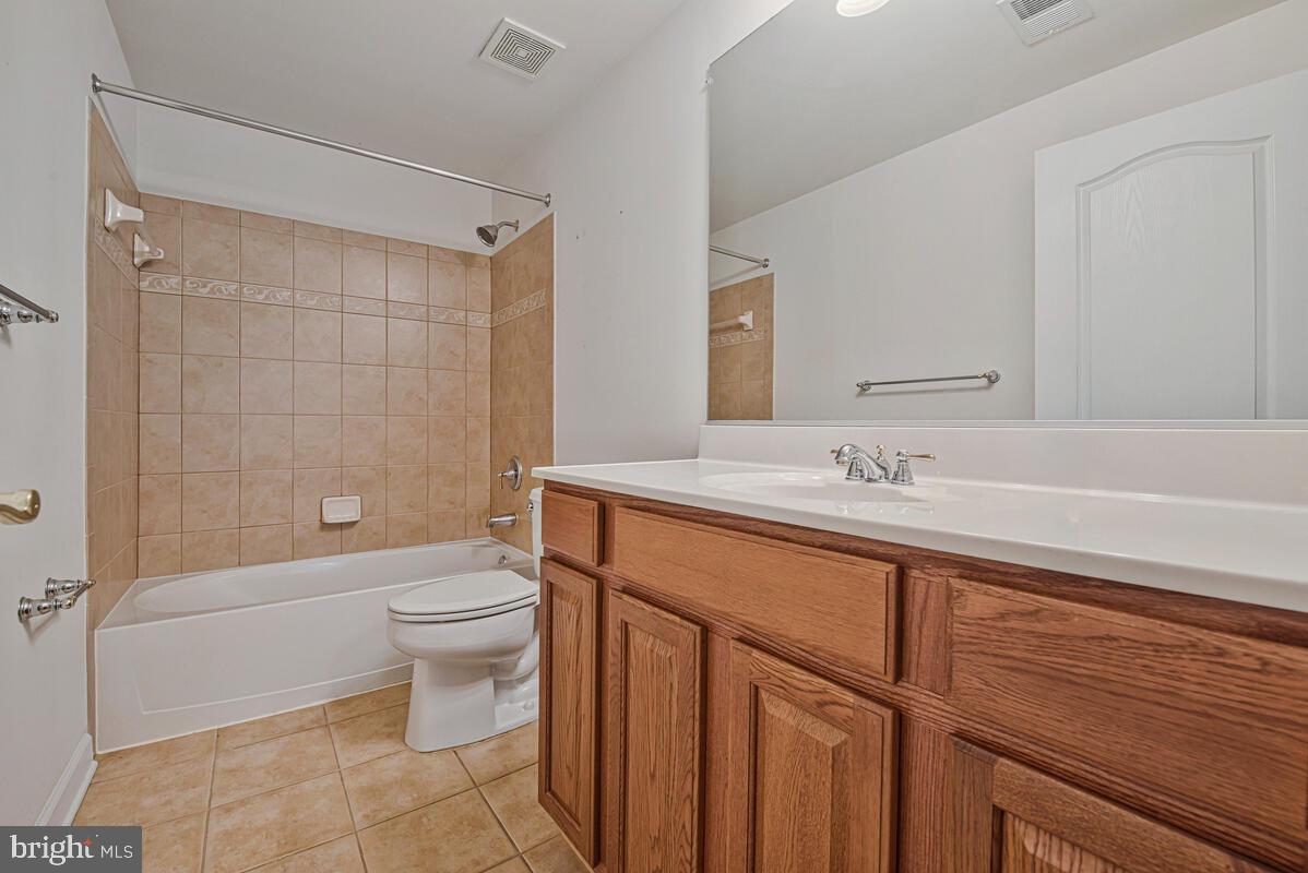 620 Crawfords Ridge Road Odenton, MD 21113 - Photo 37 of 43 a bathroom with a sink a toilet and shower