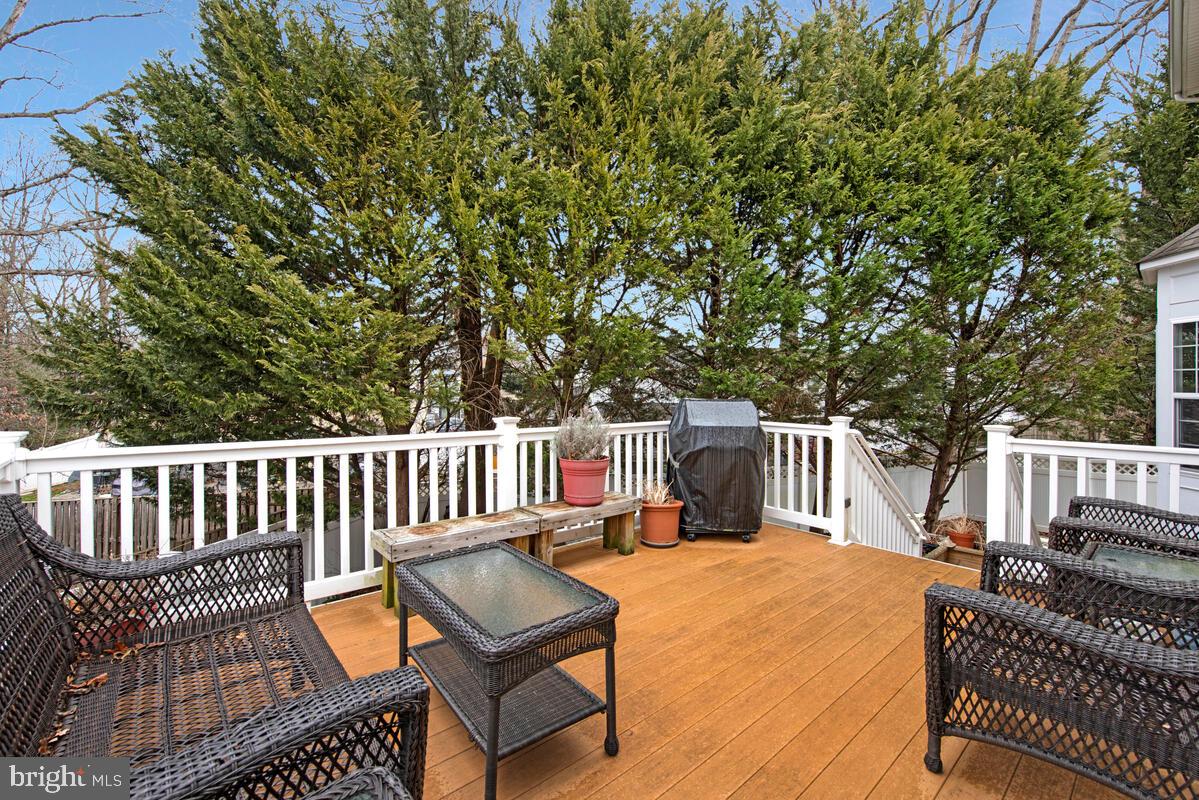620 Crawfords Ridge Road Odenton, MD 21113 - Photo 40 of 43 a view of a chair and tables under the trees