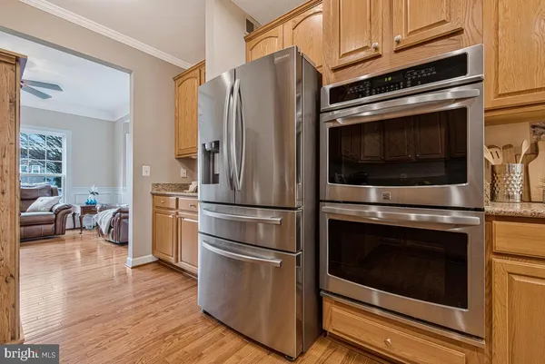a kitchen with a stove microwave and a refrigerator