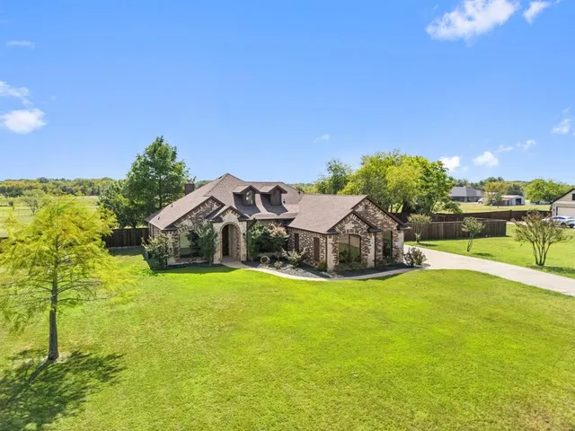 a view of a lake with a house in the background