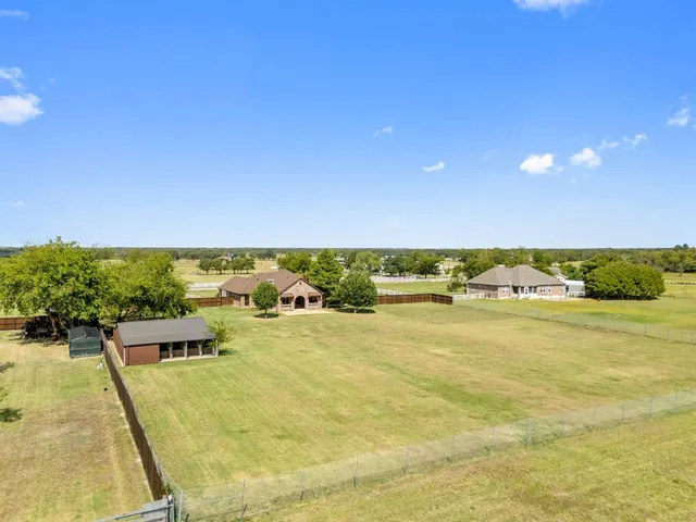 a view of a swimming pool with an outdoor seating