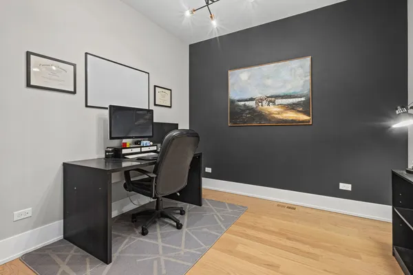 a workspace with furniture and lamp