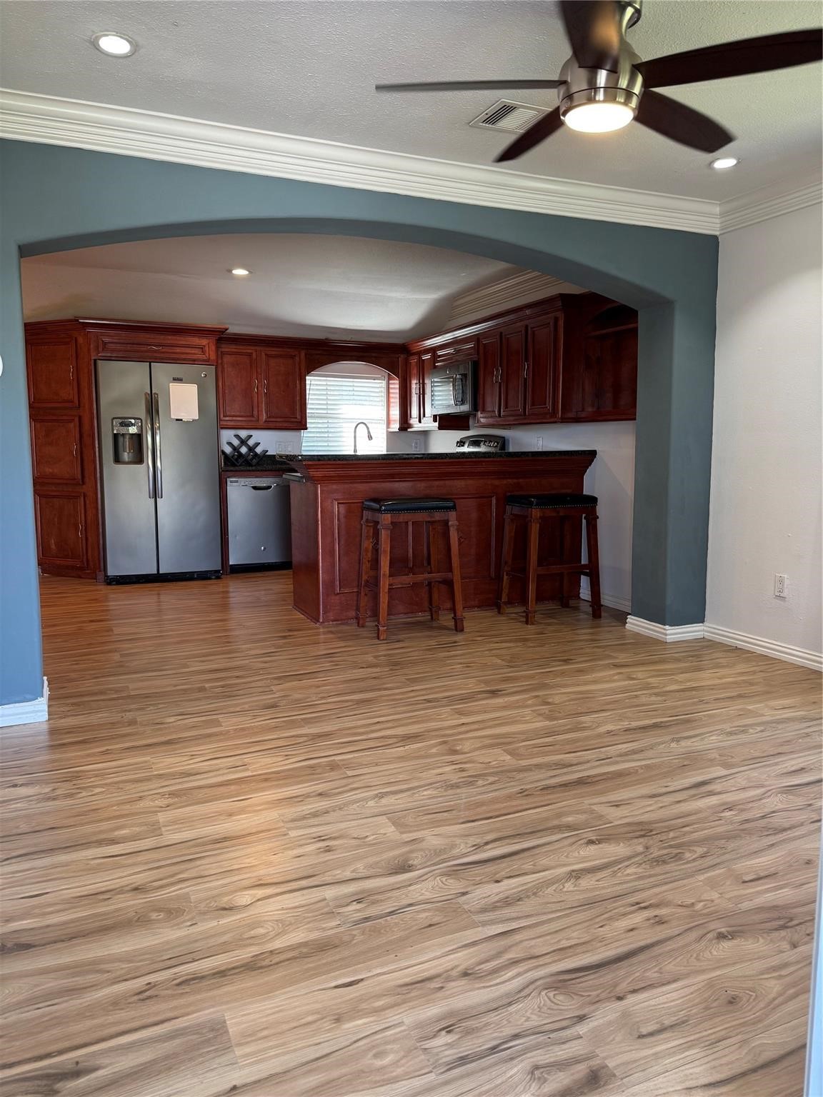 512 Melbourne Street Houston, TX 77022 - Photo 2 of 7 a view of a room with wooden floor