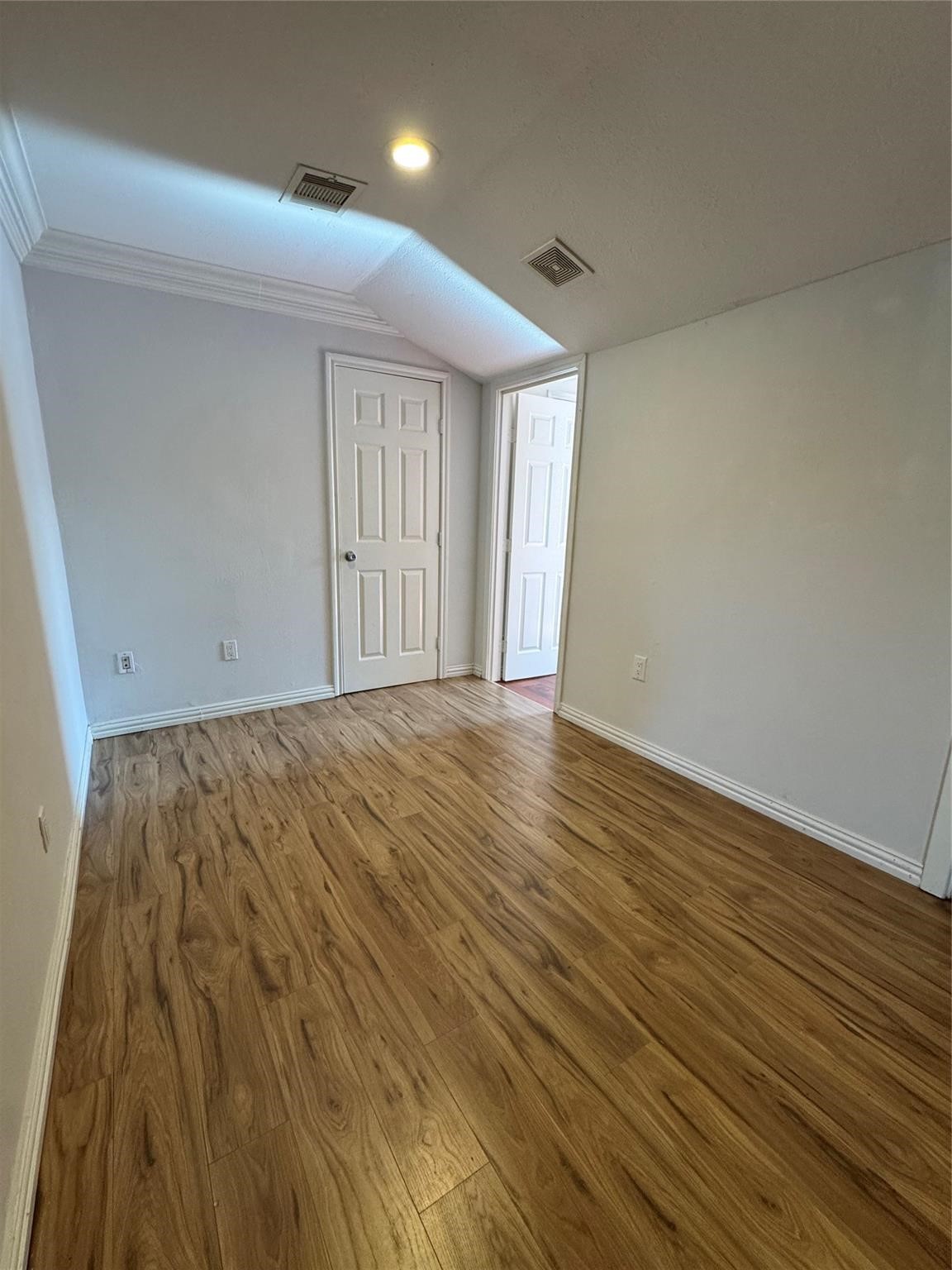512 Melbourne Street Houston, TX 77022 - Photo 3 of 7 an empty room with wooden floor