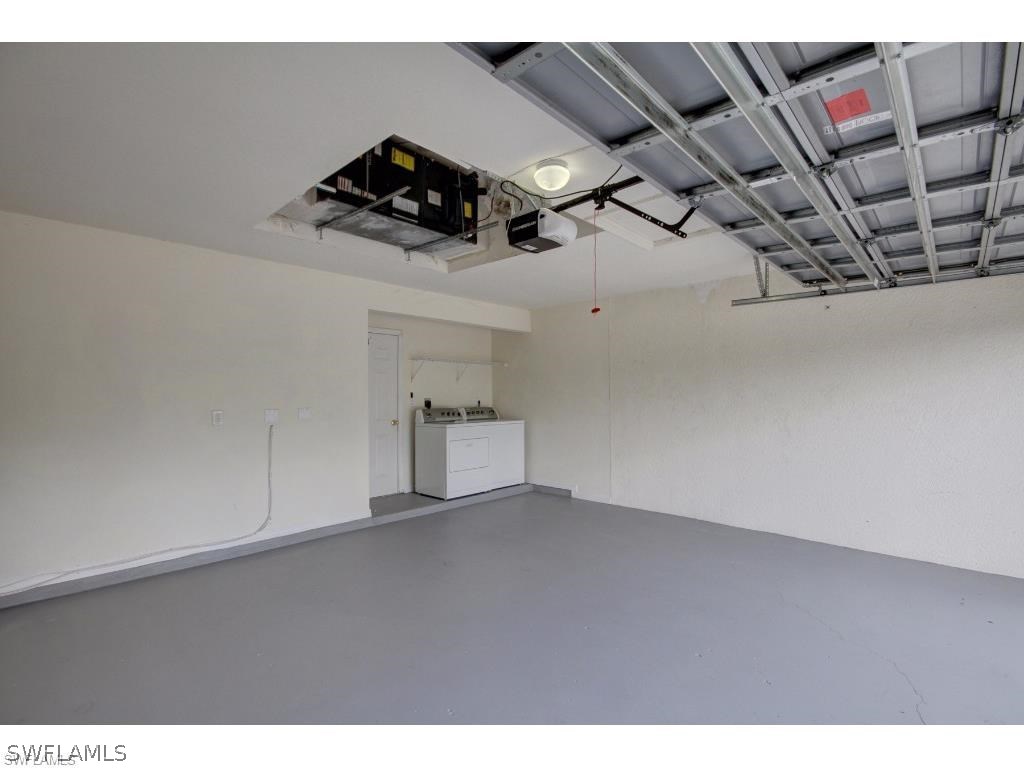 101 West 12th Street Lehigh Acres, FL 33972 - Photo 7 of 7 a view of storage and utility room with racks on the wall