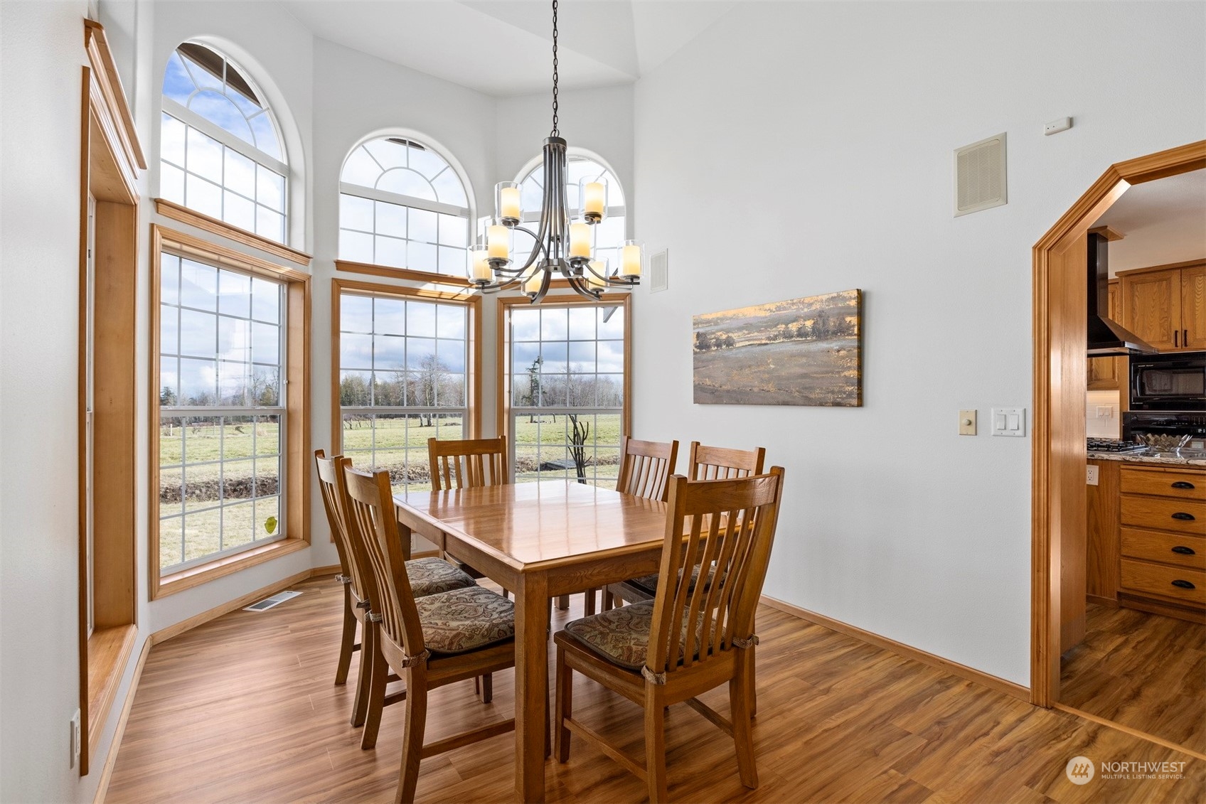 2851 Brown Road Ferndale, WA 98248 - Photo 8 of 40 a view of a dining room with furniture a chandelier and wooden floor