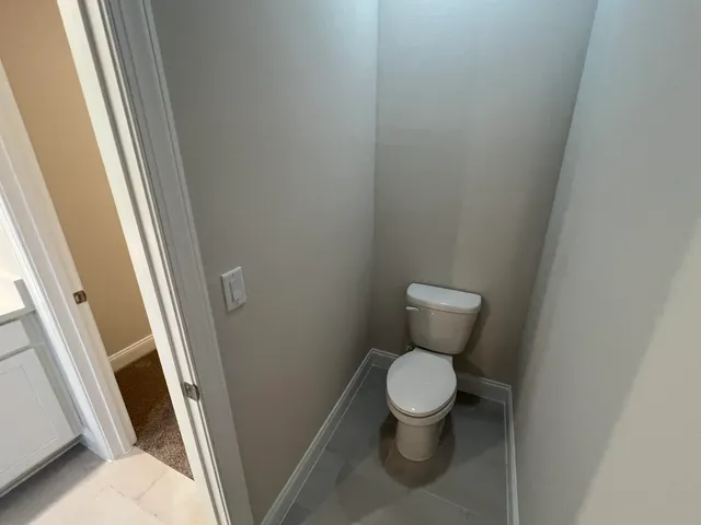 a bathroom with double vanity and a mirror