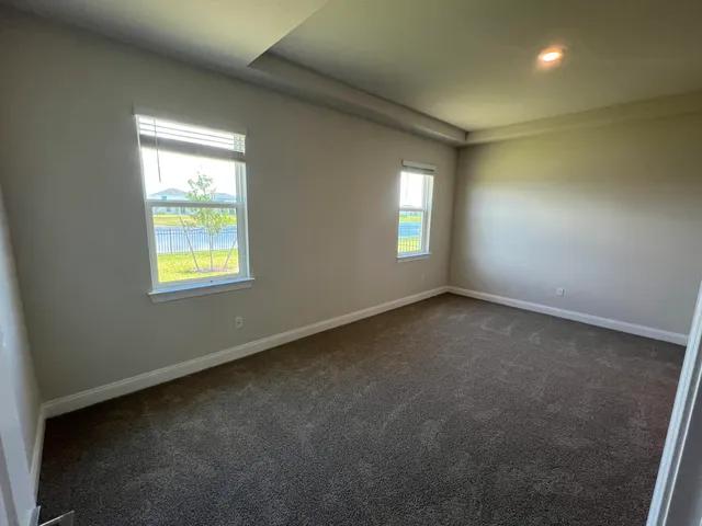 an empty room that has a window in it