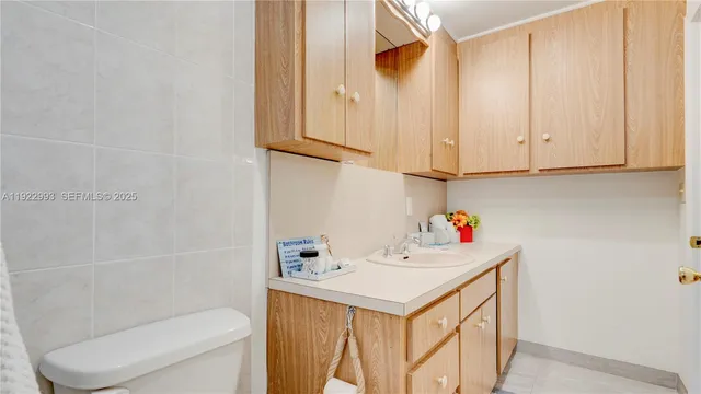 a view of a patio with table and chairs and a barbeque