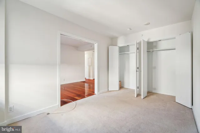 a view of room with wooden floor