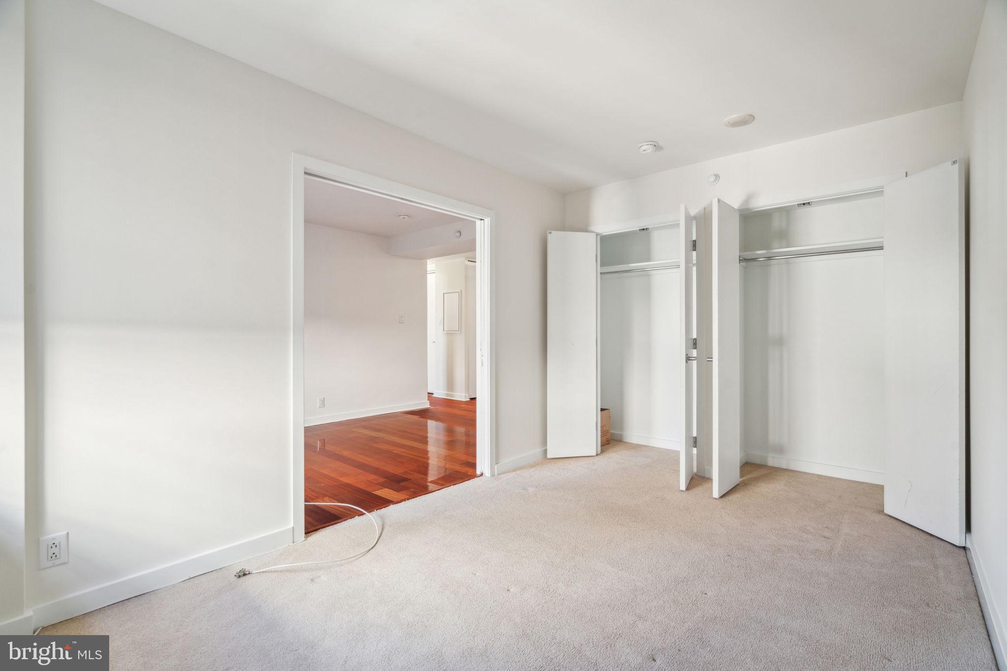 219-29 South 18th Street, Unit 1515 Philadelphia, PA 19103 - Photo 3 of 9 a view of room with wooden floor