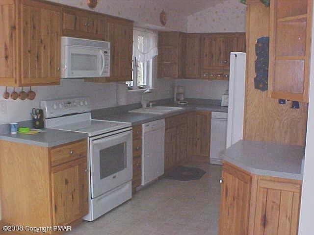 10 Hty Road Kunkletown, PA 18058 - Photo 5 of 7 a kitchen with a sink stove and cabinets