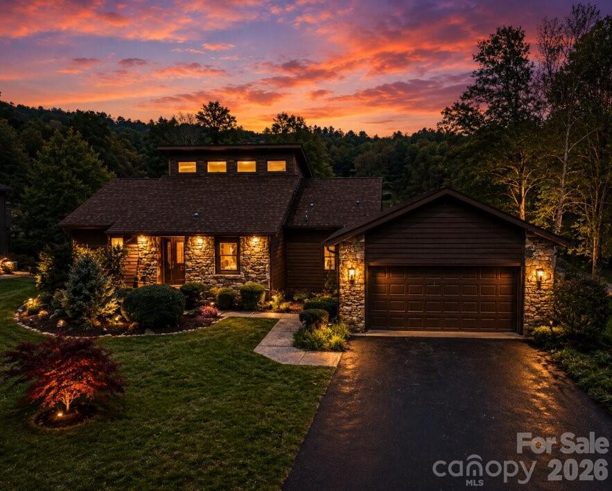 3104 Cove Loop Road Hendersonville, NC 28739 - Photo 2 of 40 a view of a house with a small yard