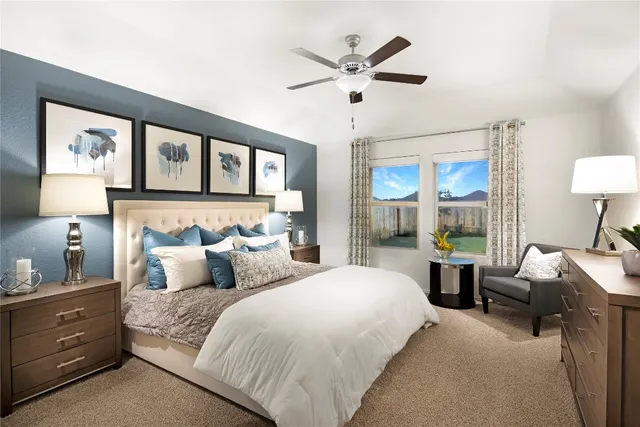 a bedroom with a large bed and a window