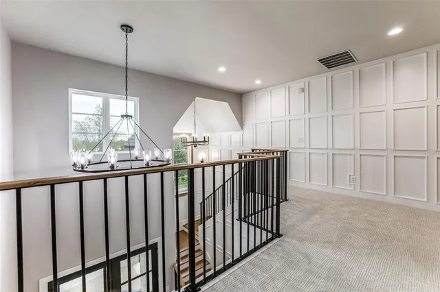 a view of hallway with windows