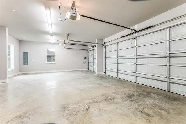 a view of an empty room with a fireplace and a window
