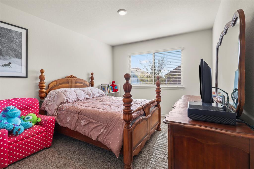 742 Buttercup Drive Pilot Point, TX 76258 - Photo 16 of 20 Bedroom featuring carpet floors