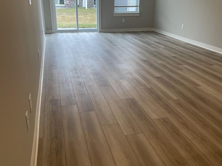 702 Mickelson Way, Unit 702 Lebanon, TN 37087 - Photo 17 of 17 wooden floor in an empty room with a window