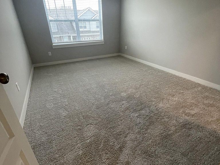 702 Mickelson Way, Unit 702 Lebanon, TN 37087 - Photo 6 of 17 an empty room with a window