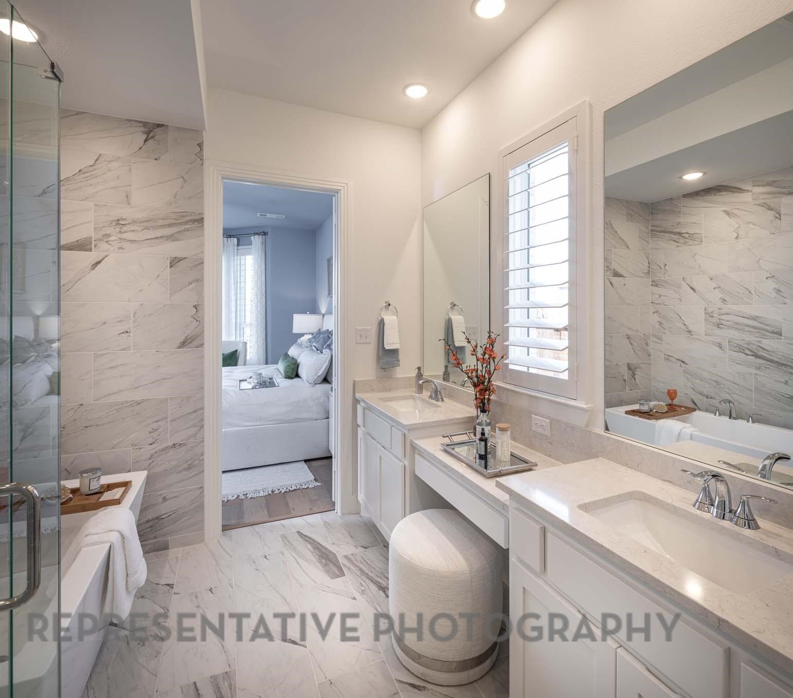 22210 Mount Whitney Road Waller, TX 77484 - Photo 16 of 29 a spacious bathroom with a sink a toilet and a mirror