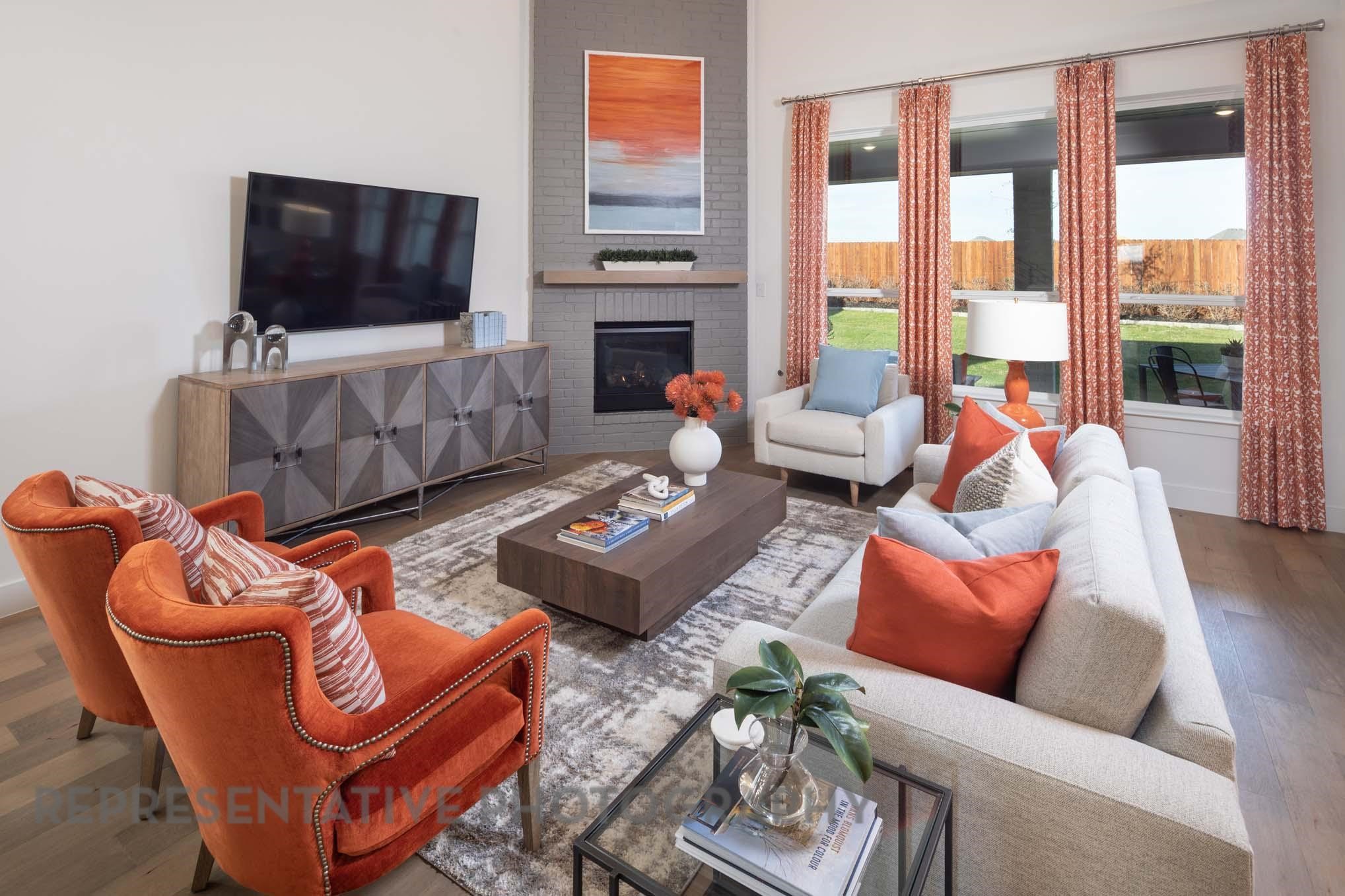 22210 Mount Whitney Road Waller, TX 77484 - Photo 4 of 29 a living room with furniture a flat screen tv and a fireplace