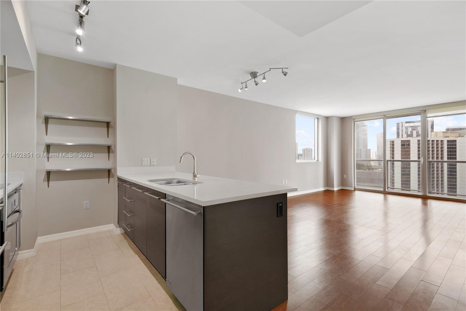 500 Brickell Avenue, Unit 2007 Miami, FL 33131 - Photo 1 of 31 a view of an empty room with a window and wooden floor