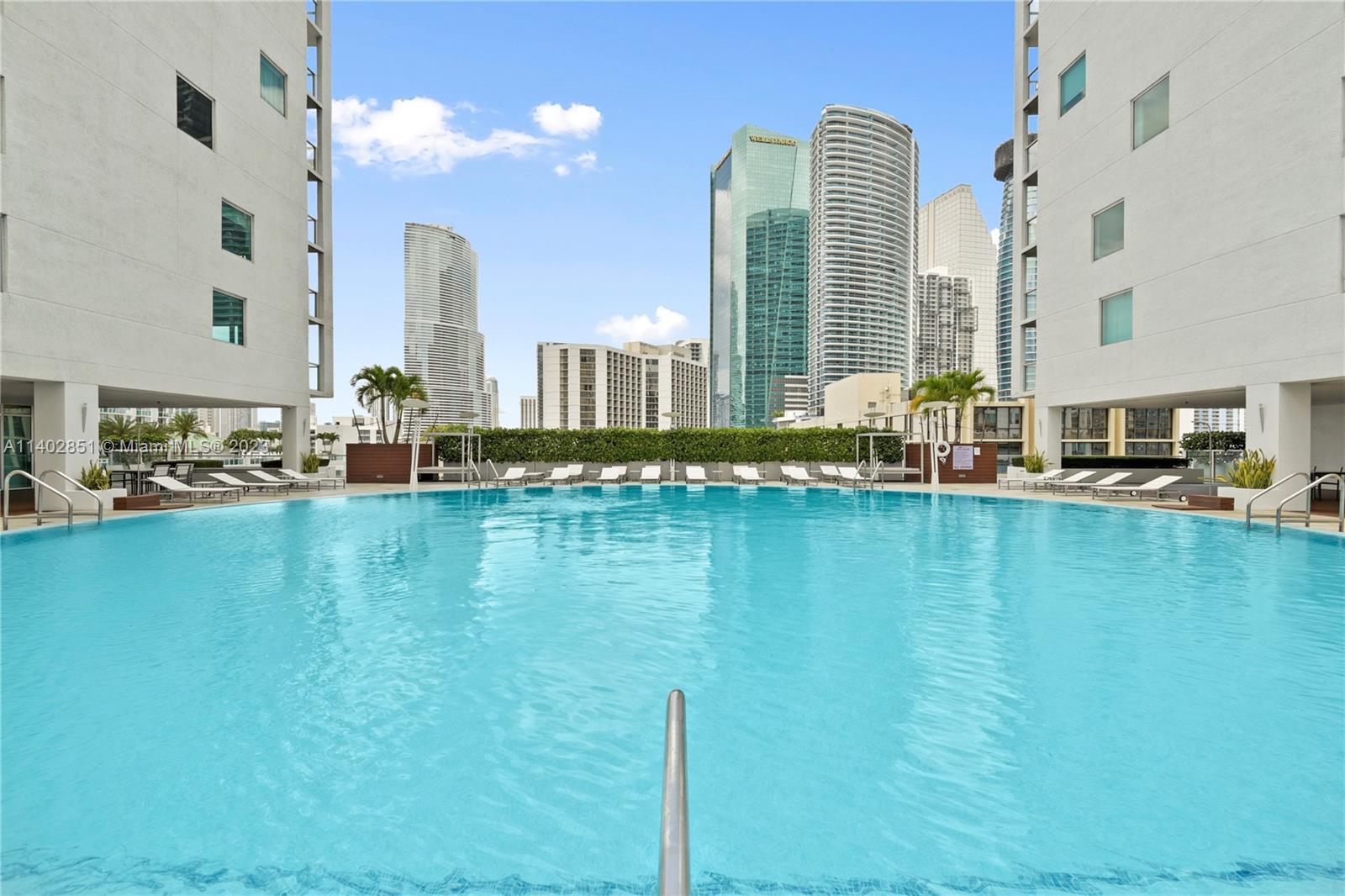 500 Brickell Avenue, Unit 2007 Miami, FL 33131 - Photo 21 of 31 a view of a swimming pool with outdoor seating