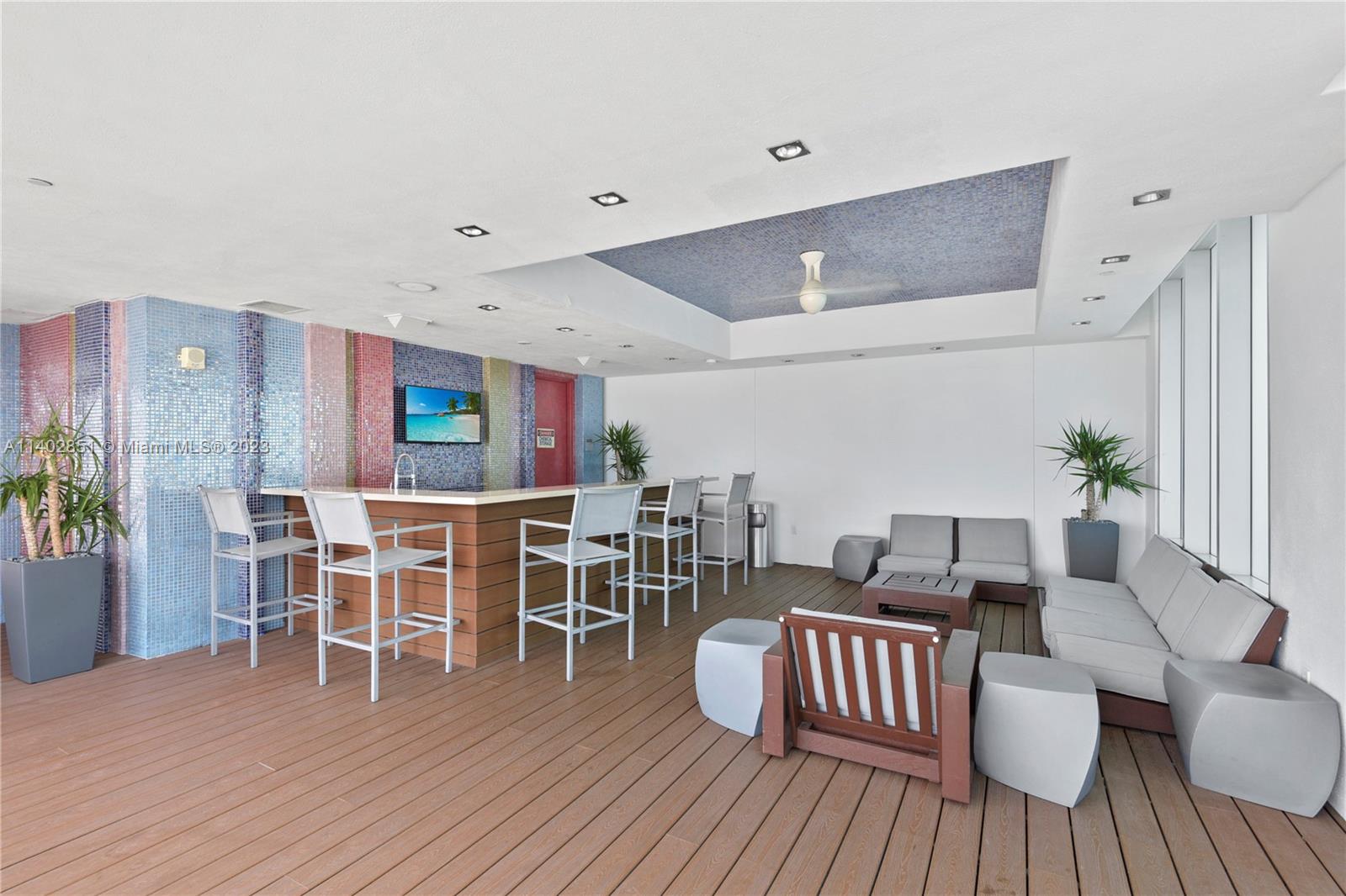 500 Brickell Avenue, Unit 2007 Miami, FL 33131 - Photo 30 of 31 a living room with furniture a wooden floor and a table