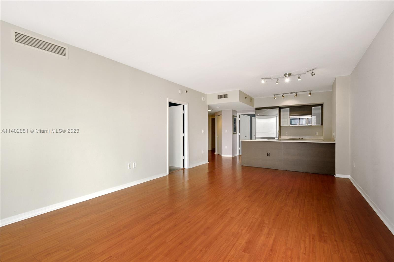 500 Brickell Avenue, Unit 2007 Miami, FL 33131 - Photo 8 of 31 a view of a kitchen with a sink and cabinet