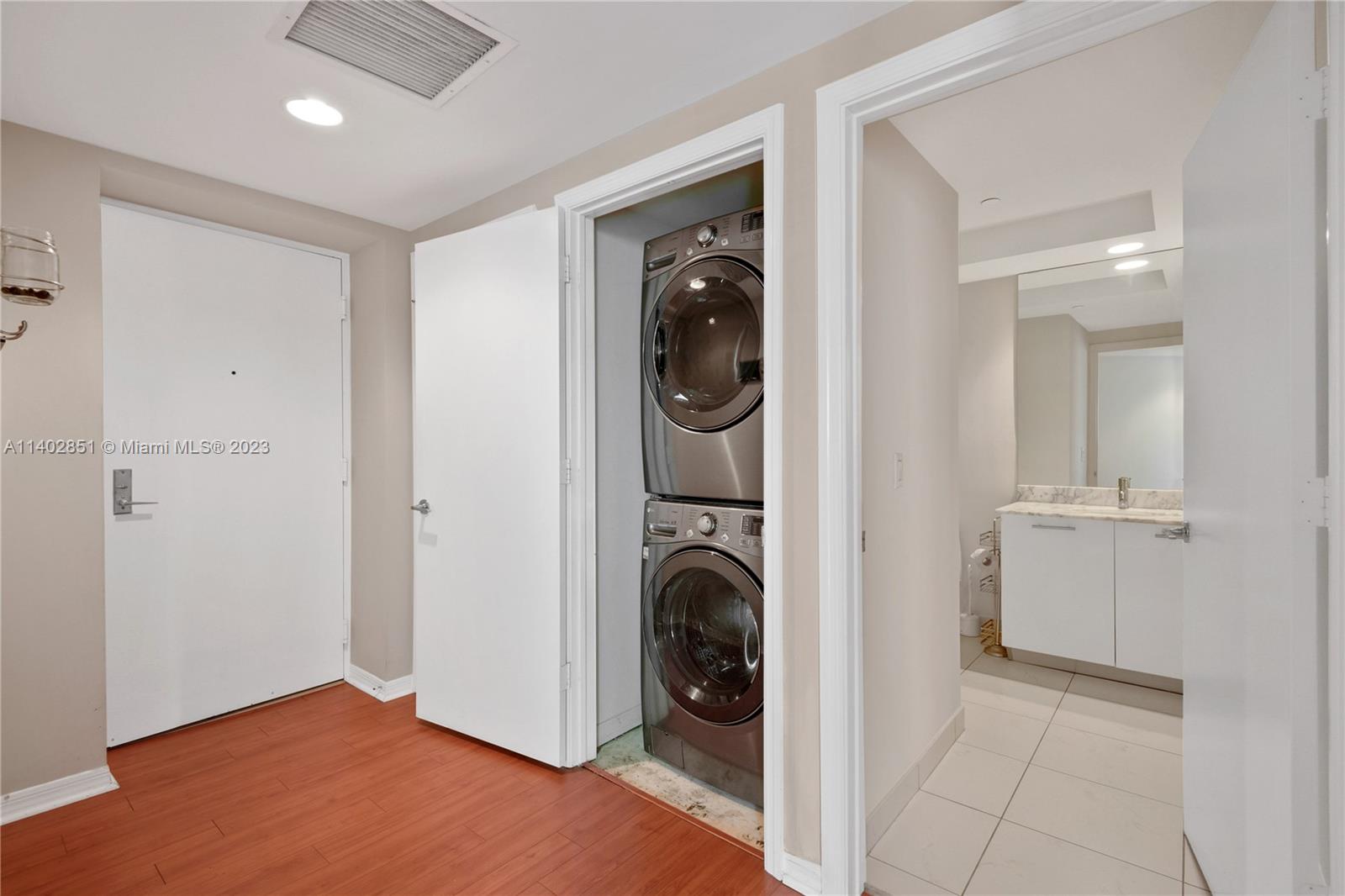 500 Brickell Avenue, Unit 2007 Miami, FL 33131 - Photo 9 of 31 a view of a hallway with washer and dryer